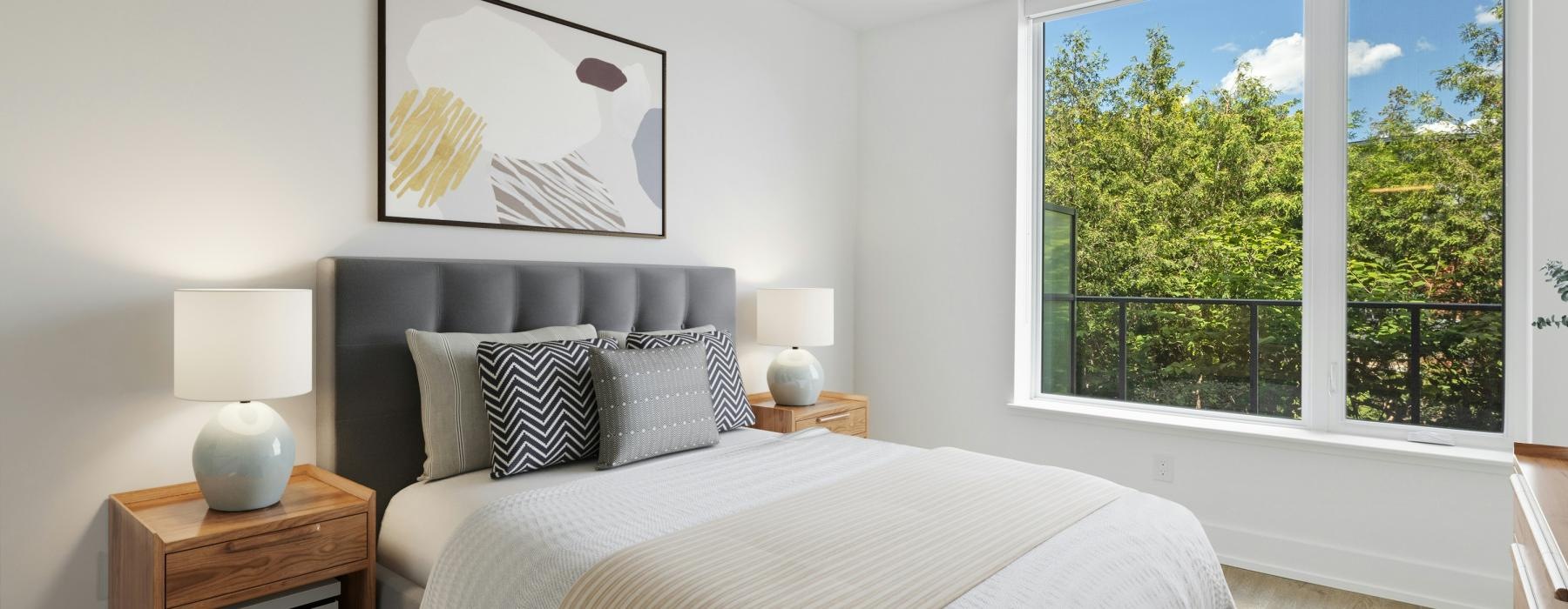 a bedroom with a large window